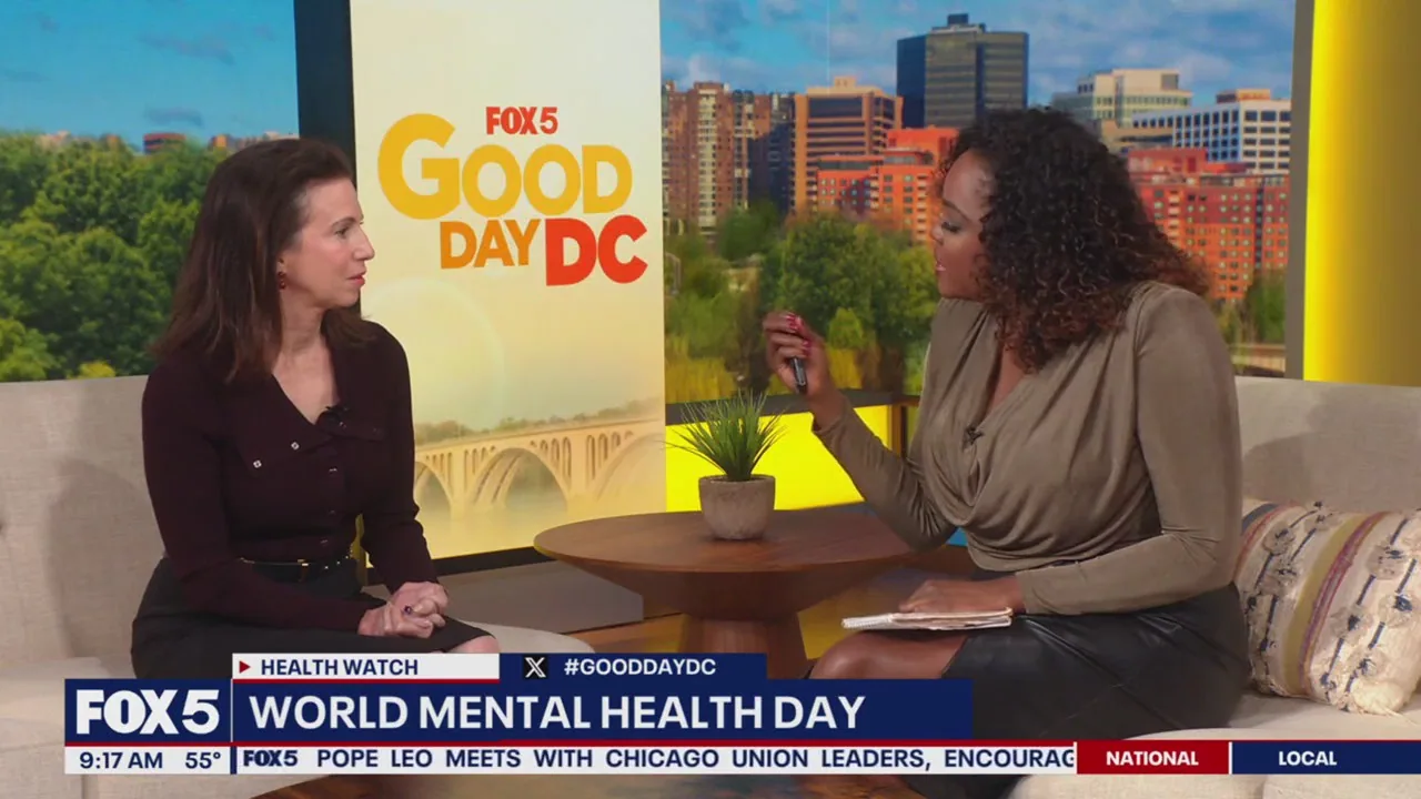 Two women seated on a couch during a television interview segment about World Mental Health Day on FOX5 Good Day DC
